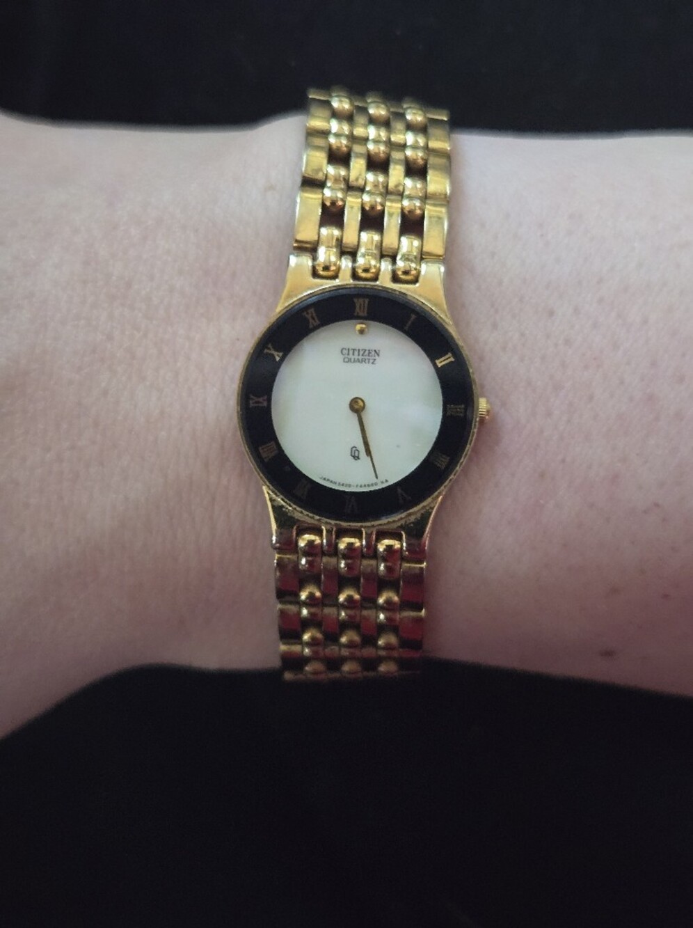 Citizen Gold-Tone Bracelet Watch with Black Bezel and Mother Of Pear Dial